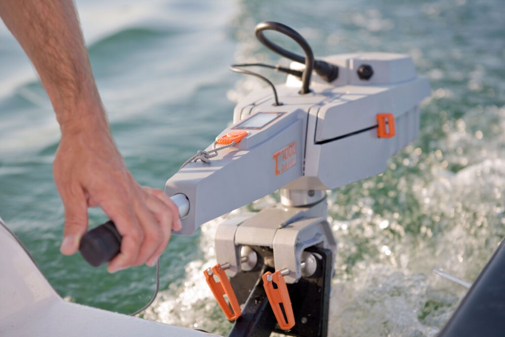 A modern electric outboard motor in action on a boat